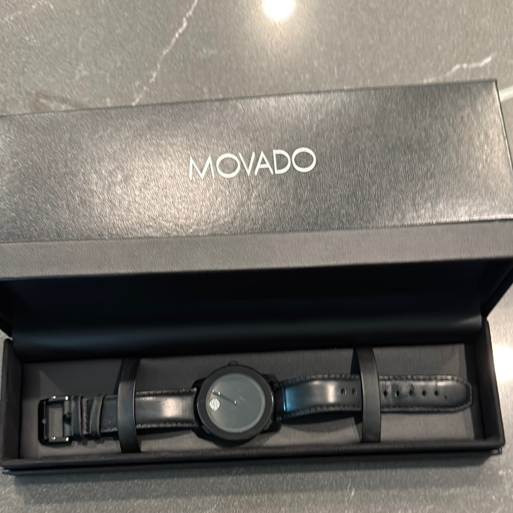 Movado BOLD All Black Dial with Rhinestone accent and Leather Band.